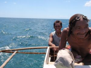 Bajau Laut Fisherman Edjie and Issau out on the Ocean
